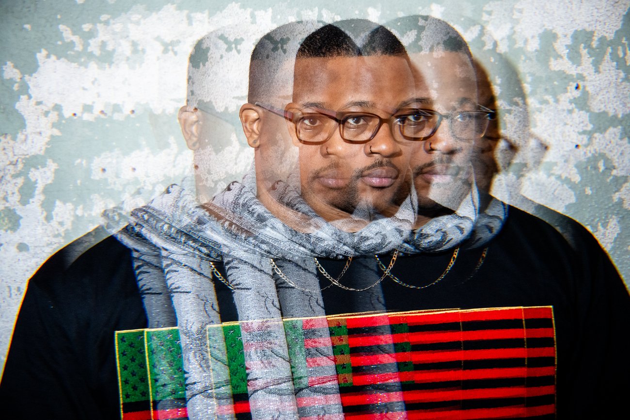 Rapper Open Mike Eagle in Pan African American flag shirt with multiple exposure effect