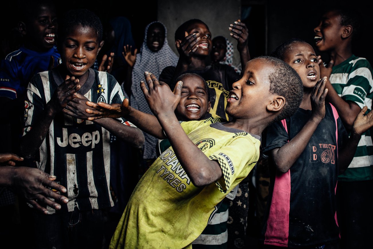 Group of young Black boys dancing and clapping
