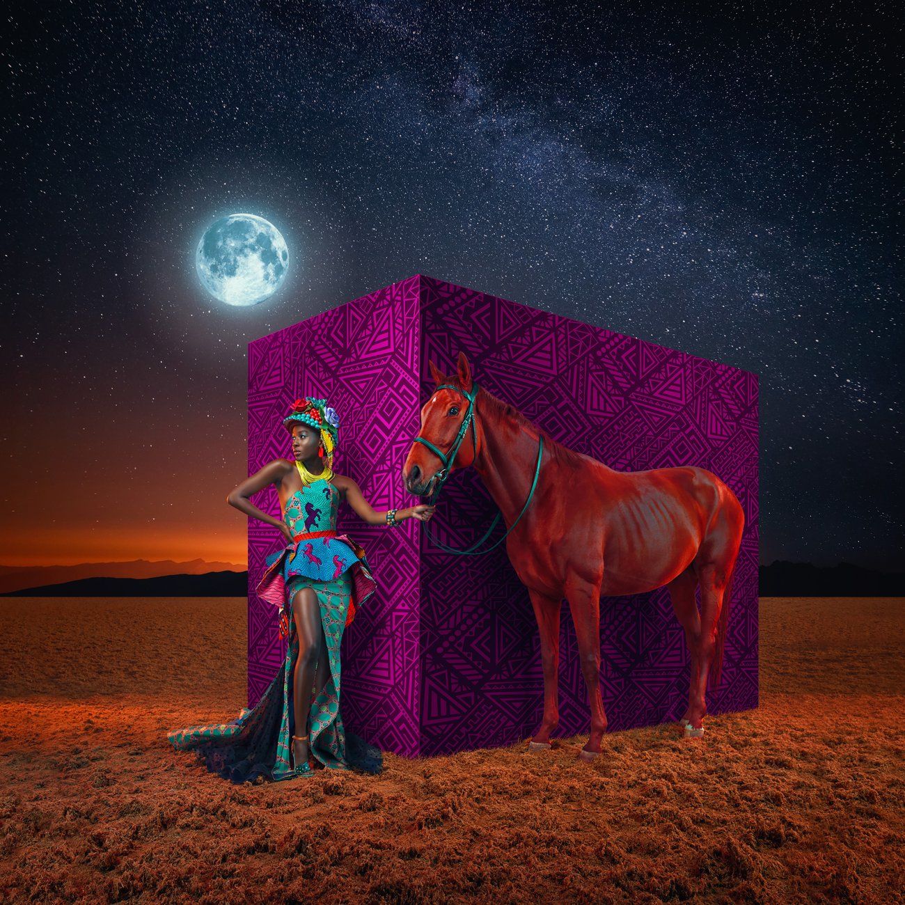 Black woman in bright colorful dress with red horse in front of purple cube in a field under a full moon night sky