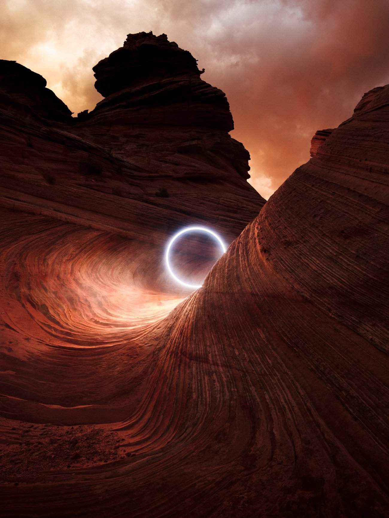 Circle of light in winding canyon of red rocks