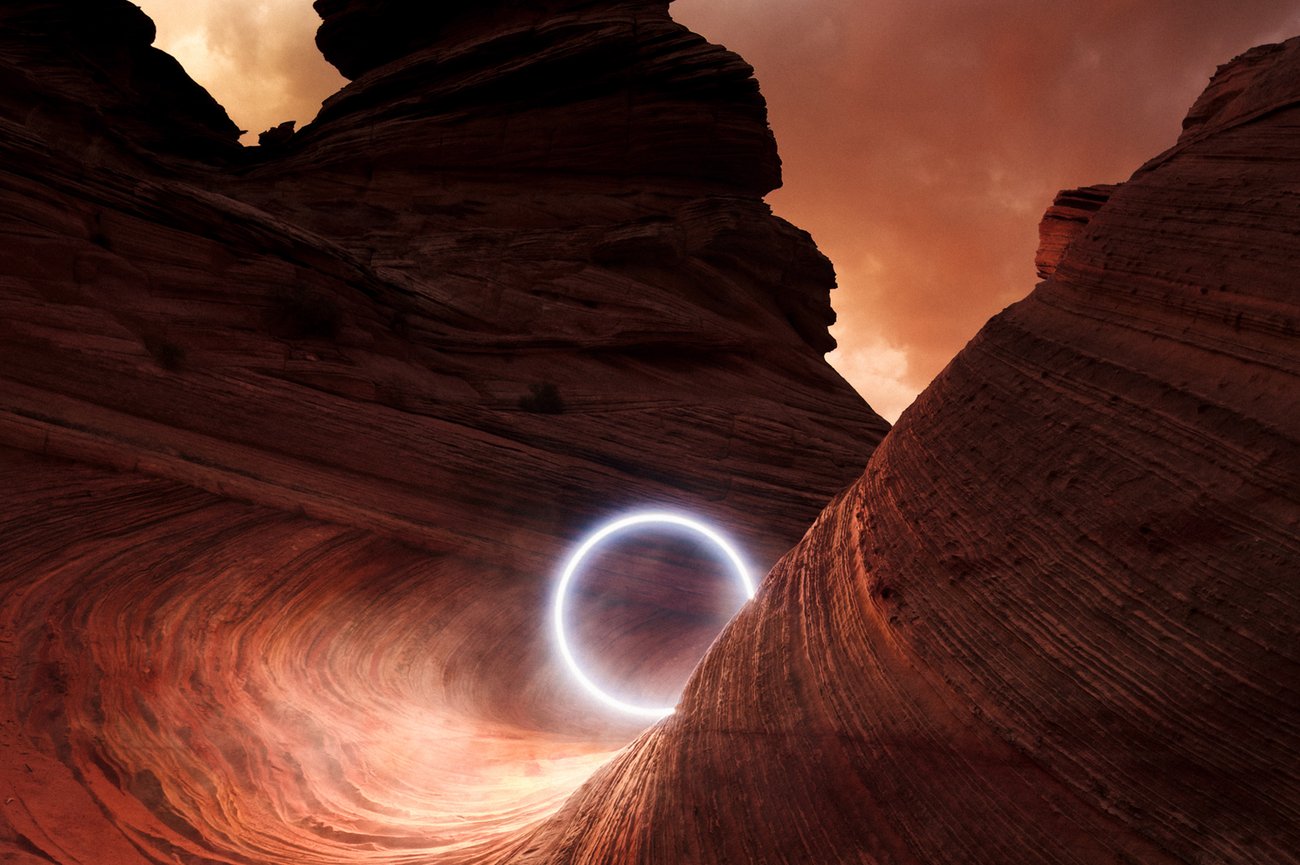 Circle of light in winding canyon of red rocks